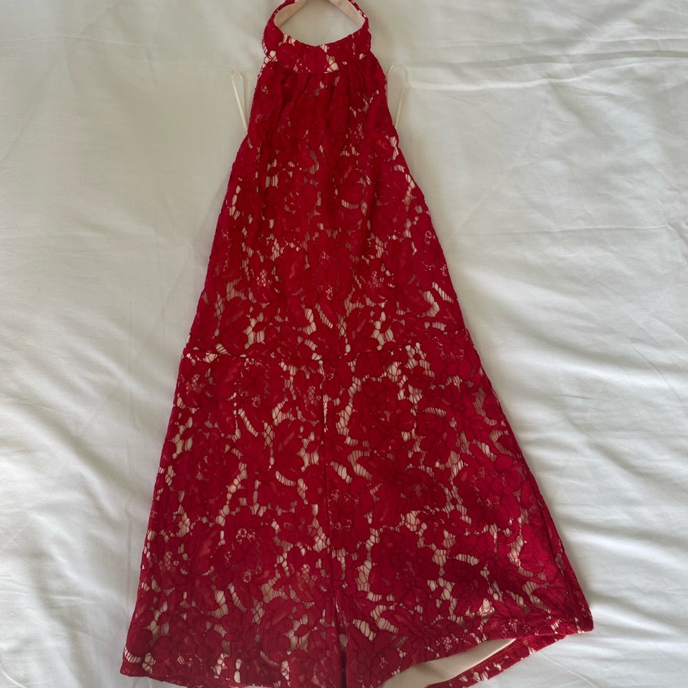 Misguided mini romper in red lace with open back and halter neck